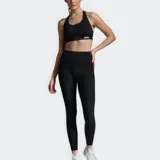 Calza de compresión de tiro alto 2XU, confeccionada en tejido de punto doble suave, con diseño de longitud completa, costuras planas y bolsillo trasero abierto.