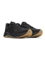Championes de entrenamiento Under Armour modelo W Aurora 3, diseñados específicamente para el pie femenino. Presentan una parte superior de malla transpirable en color negro con detalles de gamuza, mediasuela con amortiguación Charged+ y suela de goma color caramelo con patrón de tracción multidireccional.