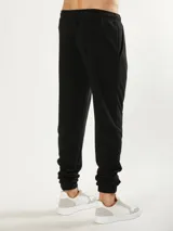 Pantalón de jogging gris claro, corte babucha, con cintura elástica ajustable con cordón.