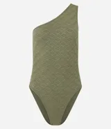 Body de hombro único con diseño sin mangas, confeccionado en tejido texturizado geométrico sin costuras. Cuenta con cierre en la entrepierna.