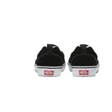 Zapatillas Vans Slip On Skate negras con suela blanca.