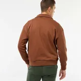 Buzo de algodón color marrón con cuello chimenea acanalado y cierre frontal parcial plateado. Presenta puños y cintura acanalados.