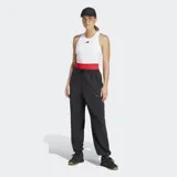 Pantalón deportivo Adidas Designed For Training Warm-Up color negro, con ajuste holgado, cintura elástica con cordón, bolsillos frontales con cierre, puños elásticos y tecnología Climacool.
