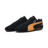 Championes Puma modelo Speedcat en colaboración con McLaren, color negro con detalles en naranja papaya. Diseño de perfil bajo inspirado en el automovilismo, confeccionado en gamuza con el logo de Puma y el emblema de McLaren en el lateral.
