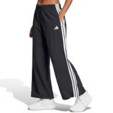 Pantalón Adidas negro con tres rayas blancas a los costados, corte ancho y cintura elástica con cordón.