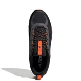 Championes de trail running Adidas Terrex Rockadia M para hombre, en color negro con detalles en naranja y suela de gran tracción.