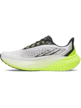 Championes de running Under Armour modelo Velociti Distance, con tecnología de amortiguación HOVR+ de longitud completa. Presentan un diseño en color blanco con detalles en amarillo neón y negro, parte superior de malla transpirable y suela de alto rendimiento.