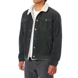 Campera de pana color negro con cuello y forro interior de borrego sintético. Presenta cierre frontal con botones metálicos, bolsillos de parche con solapa en el pecho y bolsillos laterales ribeteados.