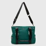 Bolso tipo tote marca Bubba, color verde, con correas de mano negras y correa larga ajustable extraíble. Cuenta con bolsillos laterales con cierre y detalles metálicos.