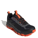 Championes de trail running Adidas Terrex Rockadia M para hombre, en color negro con detalles en naranja y suela de gran tracción.