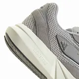 Championes Adidas Lightblaze de diseño deportivo, confeccionados en una combinación de malla transpirable y refuerzos de gamuza sintética en tono gris. Presentan cordones blancos, entresuela blanca con tecnología Lightstrike y suela de goma negra.