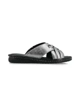 Sandalias planas Brigitte Star Smog de cuero metalizado plateado, con tiras cruzadas y elástico oculto, plantilla acolchonada de cuero y suela de poliuretano negra con costuras visibles.