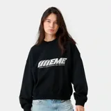 Buzo oversize negro de manga larga, con cuello redondo y estampa frontal blanca con el texto "EME" y la frase "LISTEN TO YOUR FEELINGS, FEEL THE YOUTH".
