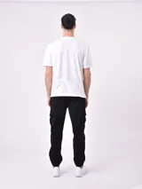 Remera blanca de algodón con estampa frontal que dice 'California' con una estrella y 'Champions League United States of America'.