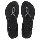 Ojotas Havaianas modelo Luna, color negro, con diseño de tiras entrelazadas que forman una sujeción en el talón.