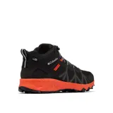 Bota de senderismo Columbia Peakfreak II Mid Outdry, color negro con entresuela naranja moteada. Presenta un diseño de altura media con malla técnica, sistema de ajuste Navic Fit, membrana impermeable OutDry y suela Adapt Trax para tracción en diversos terrenos.