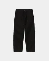 Pantalón de trabajo estilo carpenter, color negro, con refuerzos en las rodillas y remaches metálicos. Presenta un corte recto y holgado.