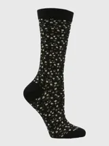 Calcetín de largo medio con estampado floral sobre fondo negro, con puño elástico y talón reforzado.