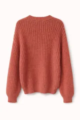 Buzo de tejido de punto grueso en color verde, con cuello redondo, mangas largas y corte holgado.