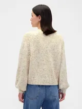 Buzo de punto de algodón con cuello redondo, mangas largas con hombros caídos y puños y ruedo acanalados. Diseño de corte holgado.