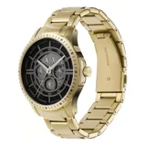 Reloj de pulsera con caja y malla de acero inoxidable en tono dorado. Presenta una esfera negra con diseño texturizado, manecillas luminiscentes y subesferas multifunción.