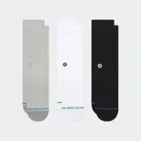 Pack de tres pares de medias Stance de caña media, en colores gris, blanco y negro. Presentan un diseño liso con el logo de la marca bordado en el lateral y detalle de marca en la puntera.