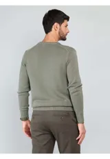 Sweater de punto con cuello redondo, diseño liso y puños y ruedo acanalados.