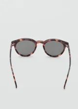 Gafas de sol con diseño redondo y montura de pasta con estampado carey. Cuentan con protección UV categoría 3.