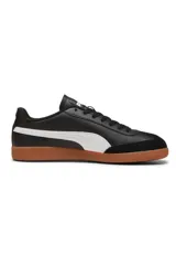 Championes Puma modelo 9T, color negro con franja lateral blanca y suela de goma marrón estilo gum, con puntera de gamuza.