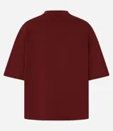 Blusa básica de mujer color negro, confeccionada en malla encorpada de algodón, con cuello redondo y mangas cortas de corte oversized con sisas desplazadas.