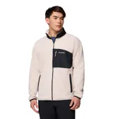 Campera de polar Columbia con cierre frontal completo, cuello alto y bolsillo con cierre en el pecho. Presenta un diseño bicolor con detalles en contraste en el bolsillo, cuello, puños y dobladillo.
