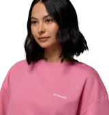 Buzo de cuello redondo de la marca Columbia, modelo Aldermore Crew, de color rosado con el logo bordado en el pecho. Presenta un diseño holgado, de mangas largas con puños y dobladillo acanalados.