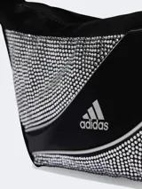 Bolso de hombro Adidas de diseño curvo, color negro, decorado con aplicaciones de pedrería brillante en los laterales y logo de la marca estampado en el centro.