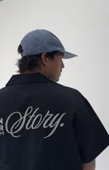 Gorro tipo jockey color azul, con visera curva y bordado frontal que dice "Faded" en blanco y "Sunset Flower Faded Sense Again" en naranja.