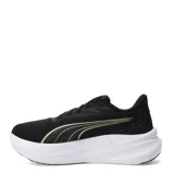 Championes de running Puma Max Stride Lite para mujer, color negro con detalles dorados y suela gruesa blanca.