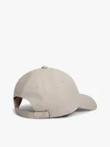 Gorra de béisbol Tommy Jeans color beige, con visera curva, ojales de ventilación y parche bordado con el logo de la marca en el frente.