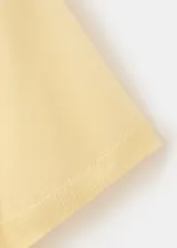 Buzo de punto en mezcla de lyocell y seda, color amarillo claro, de diseño recto, manga corta y cuello polo.