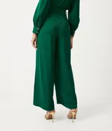 Pantalón pantalona verde esmeralda de jacquard con botones diferenciados en la cintura.