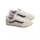 Championes Vans modelo Super Lowpro, color crema con detalles en negro y suela de goma color caramelo. Presentan un diseño de perfil bajo con perforaciones laterales y cordones blancos.
