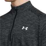 Buzo deportivo Under Armour Tech Textured 1/2 Zip de hombre, color gris melange con diseño texturizado, cuello alto con cierre parcial y manga larga raglán. Presenta el logo de la marca estampado en blanco en el pecho.