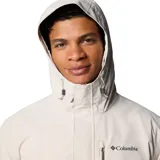 Campera impermeable Columbia modelo Hikebound II Jacket, con diseño en bloques de color beige en la parte superior y marrón claro en la inferior. Cuenta con capucha ajustable, cierre frontal, bolsillos con cremallera y tecnología Omni-Tech.