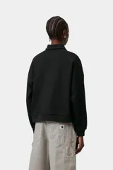 Sweater estilo polo Carhartt Wip modelo Brenta, color negro, de corte holgado y recto. Confeccionado en punto de algodón, cuenta con cuello clásico, media tapeta con botones y el logotipo de la marca bordado en el pecho.