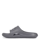 Sandalias Under Armour Slide de una sola pieza de EVA color gris, con orificios de drenaje y el logo de la marca en relieve en la tira frontal.