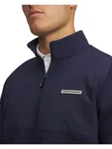 Buzo Under Armour Drive Pro Hybrid con media cremallera para hombre, de color azul marino, con cuello alto, tecnología UA Storm impermeable y aislamiento ligero.