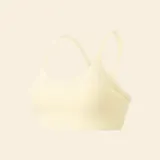 Sujetador deportivo de color amarillo pastel, con diseño de espalda nadadora y tirantes finos. Confeccionado en tejido elástico y transpirable, ideal para actividades de bajo impacto.