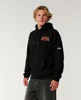 Canguro negro con capucha y bolsillo tipo canguro, confeccionado con felpa de algodón. Presenta un gran estampado gráfico en la espalda con la inscripción 'Bells Beach Australia' y un diseño alusivo al evento de surf, con llamas en los laterales.