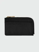 Tarjetero Longchamp de la línea Le Foulonné, confeccionado en cuero granulado negro. Presenta un diseño compacto con cierre superior de cremallera metálica dorada y logo de la marca grabado en el frente.