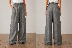 Pantalón de vestir de corte amplio y tiro alto, confeccionado en lino. Presenta una pretina estructurada, tablas frontales que aportan movimiento, bolsillos laterales y un detalle decorativo de mini bolsillo con tapa y botón en la cadera. La parte trasera cuenta con bolsillos ojal y cintura elástica.