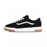Championes Vans Hylane de estilo skate, color negro con la clásica franja lateral Sidestripe en blanco. Presentan cordones gruesos blancos, suela blanca gruesa de gran amortiguación y suela exterior de goma tipo waffle de color caramelo.