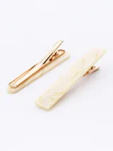 Set de dos broches para el pelo color crema con diseño marmolado.